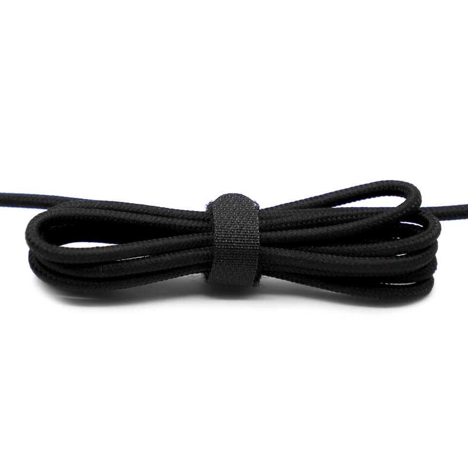 Close-up of a neatly tied black headphone cord, perfect for organizing and storing bulk school headphones.
