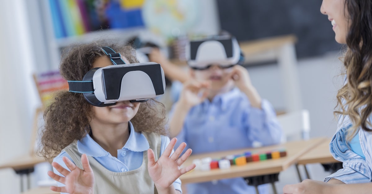 Students using virtual reality headsets in a classroom during a guided learning activity