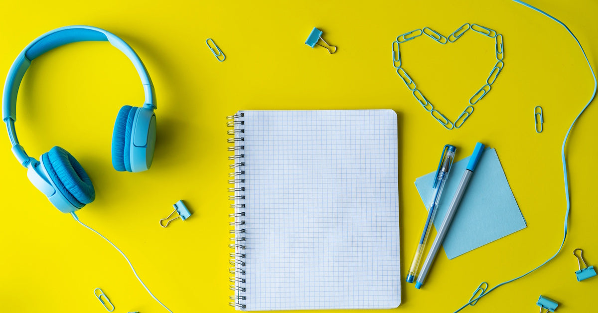 Back-to-school classroom audio equipment checklist with headphones, notebook, and school supplies