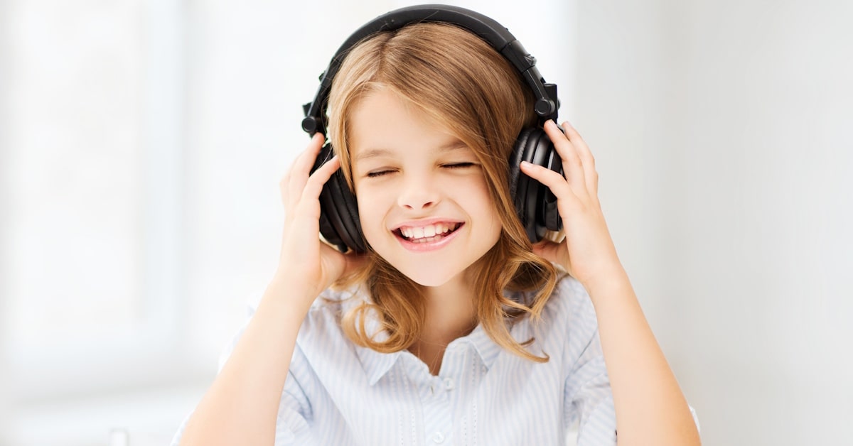 Student wearing over-ear headphones suitable for school and educational environments