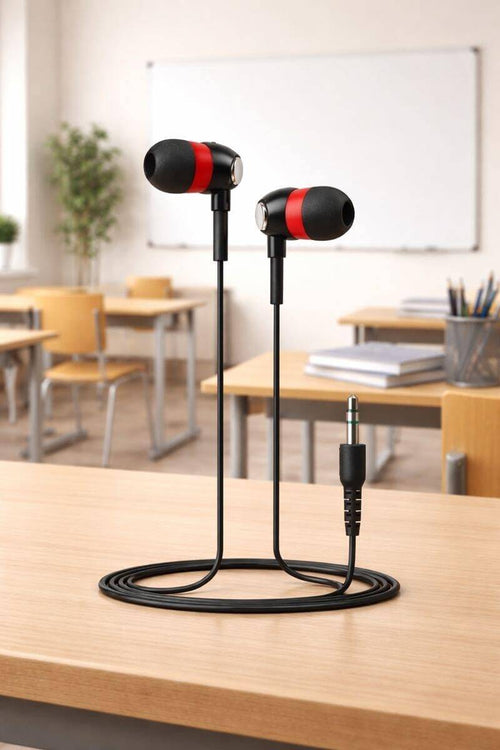 essential classroom earbuds on desk 