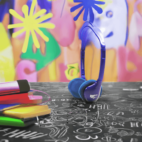Vibrant blue school headphones on a colorful background, ideal for educational use and bulk purchases.