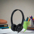 AC-125 On-Ear Stereo Headphones on a desk, ideal bulk school headphones for student learning and multimedia engagement.