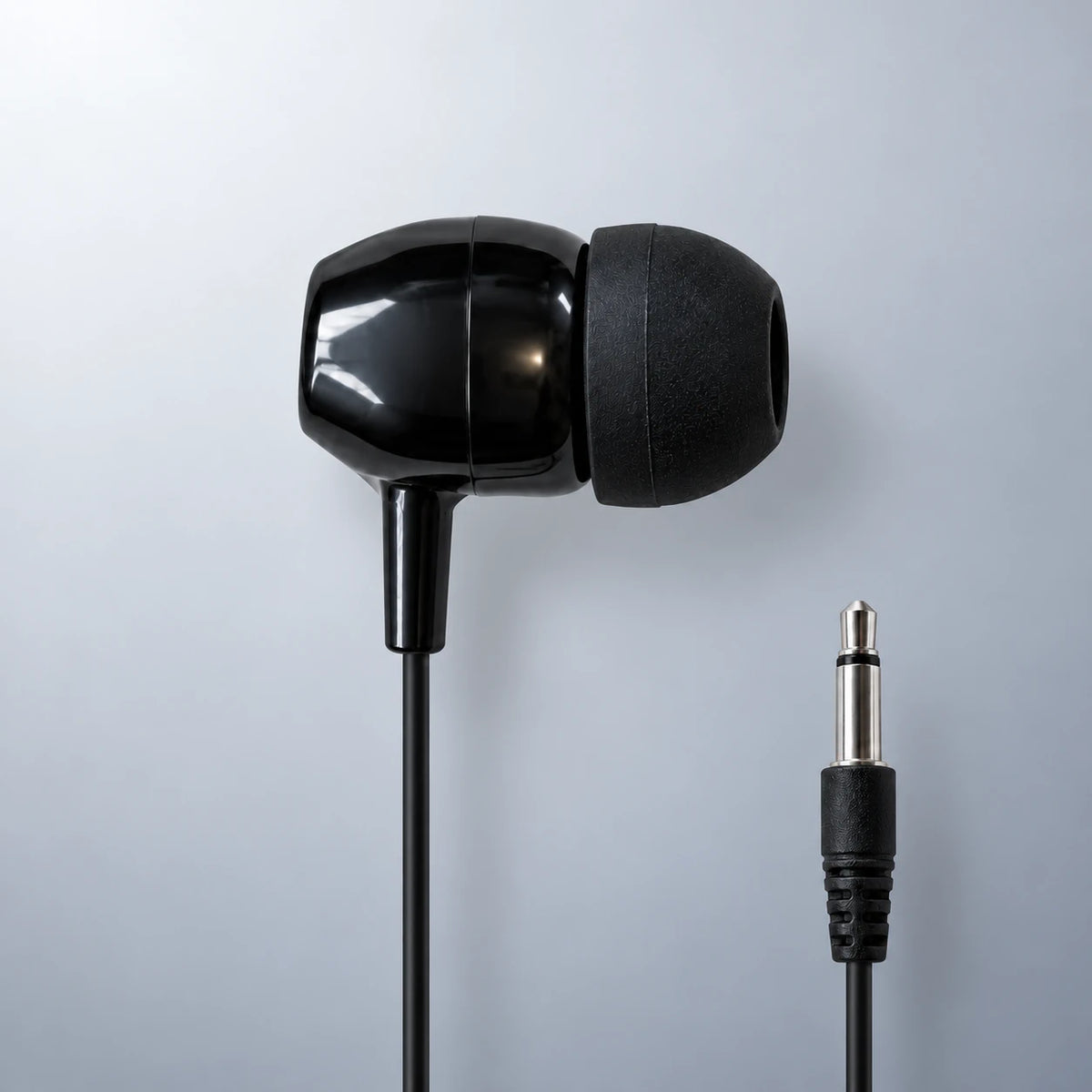LH-50 single mono earbud and 3.5mm mono plug, close-up