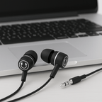 SoundLH earbuds with laptop on a table