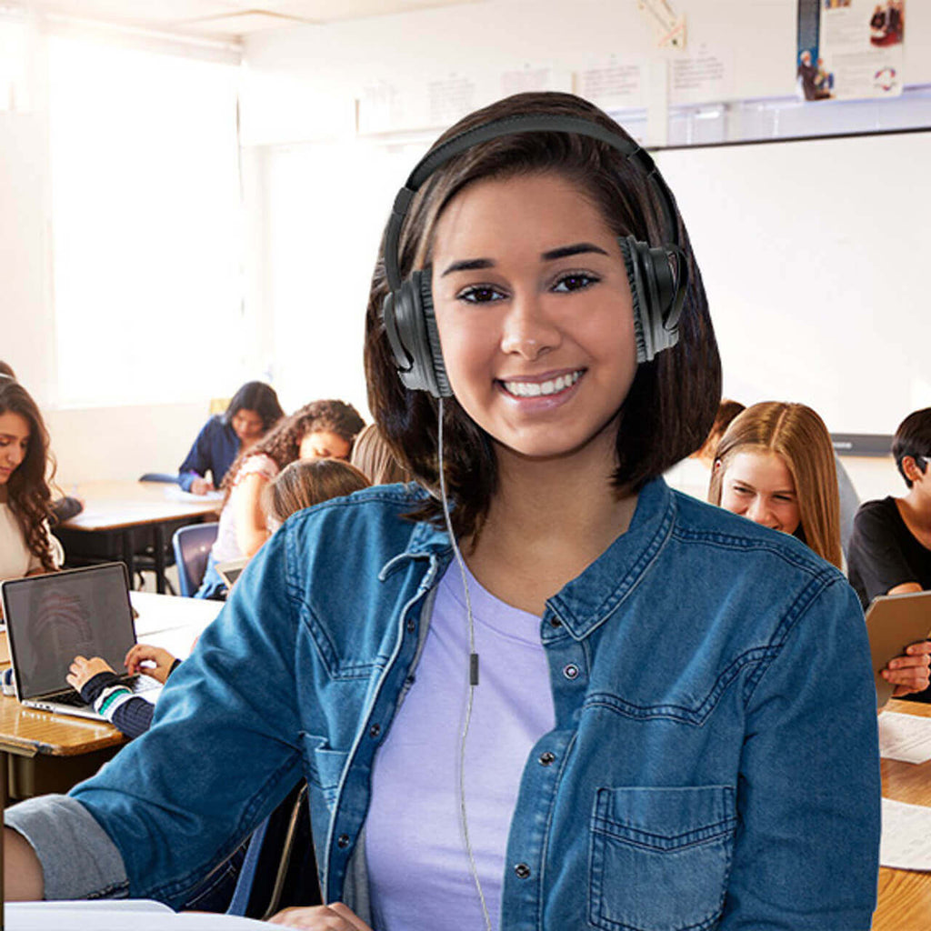 Student using HamiltonBuhl Deluxe Active Noise-Cancelling Headset in classroom, ideal for school headphones.