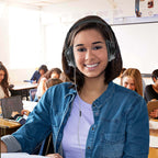 Student using HamiltonBuhl Deluxe Active Noise-Cancelling Headset in classroom, ideal for school headphones.